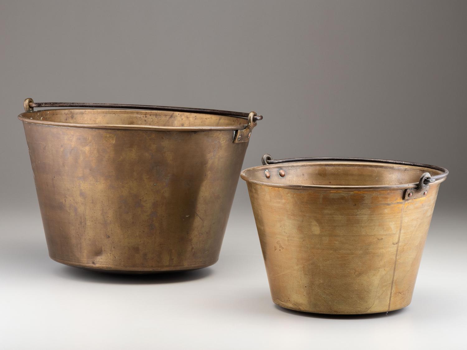A Copper and Wrought Iron Bowl and Two Spun Brass Buckets