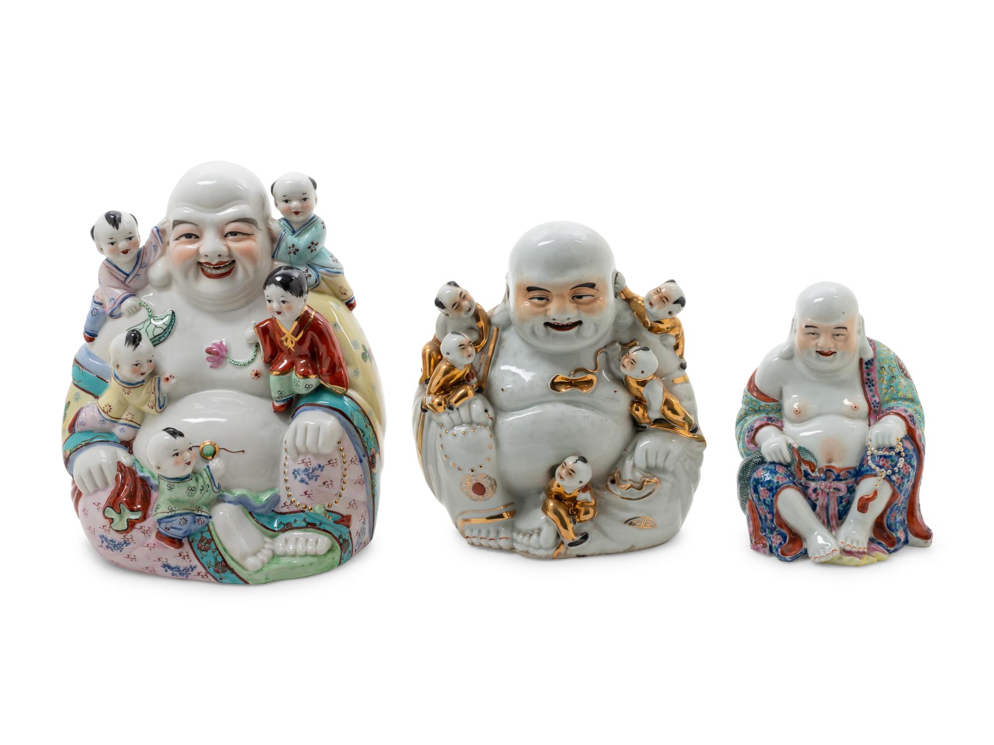 Three Famille Rose Porcelain Figures of Buddhas