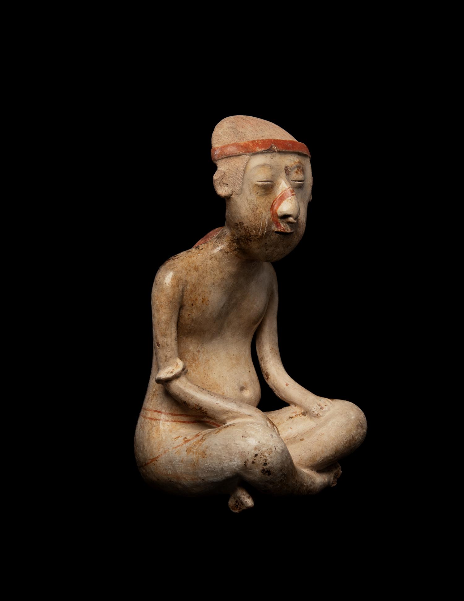 A Nayarit Pottery Seated Male Figure
