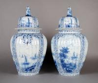 A Pair of Continental Vases and Covers, Height 16 1/2 inches.