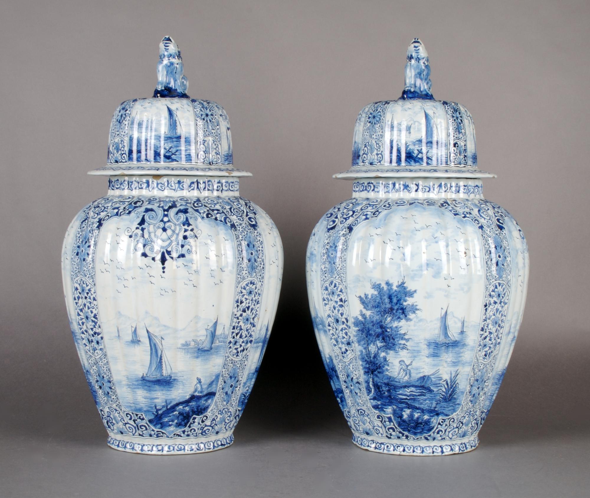 A Pair of Continental Vases and Covers, Height 16 1/2 inches.