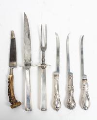 A Group of Silver-Handled Carving Articles, various makers, comprising a two-piece carving set and three filet knives, together with a