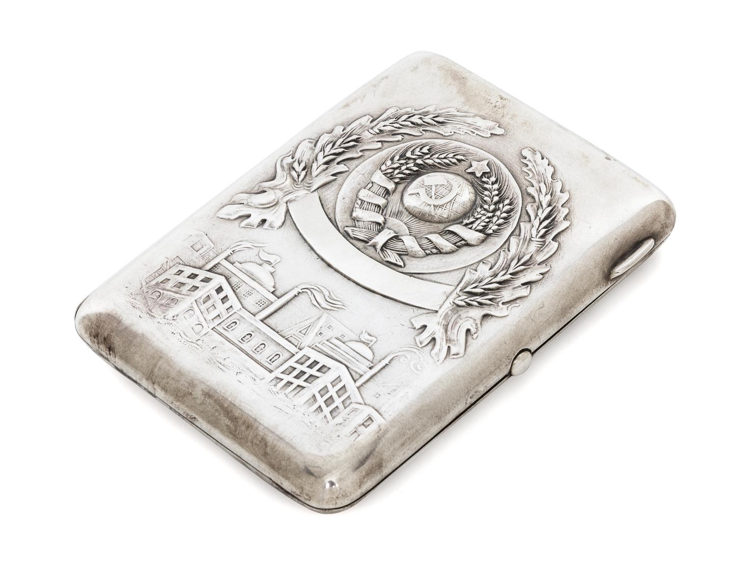 A Russian Silver Cigarette Case, Retailed by Mostorg, Moscow, 20th century, the lid worked with the seal of the Soviet Union above an i