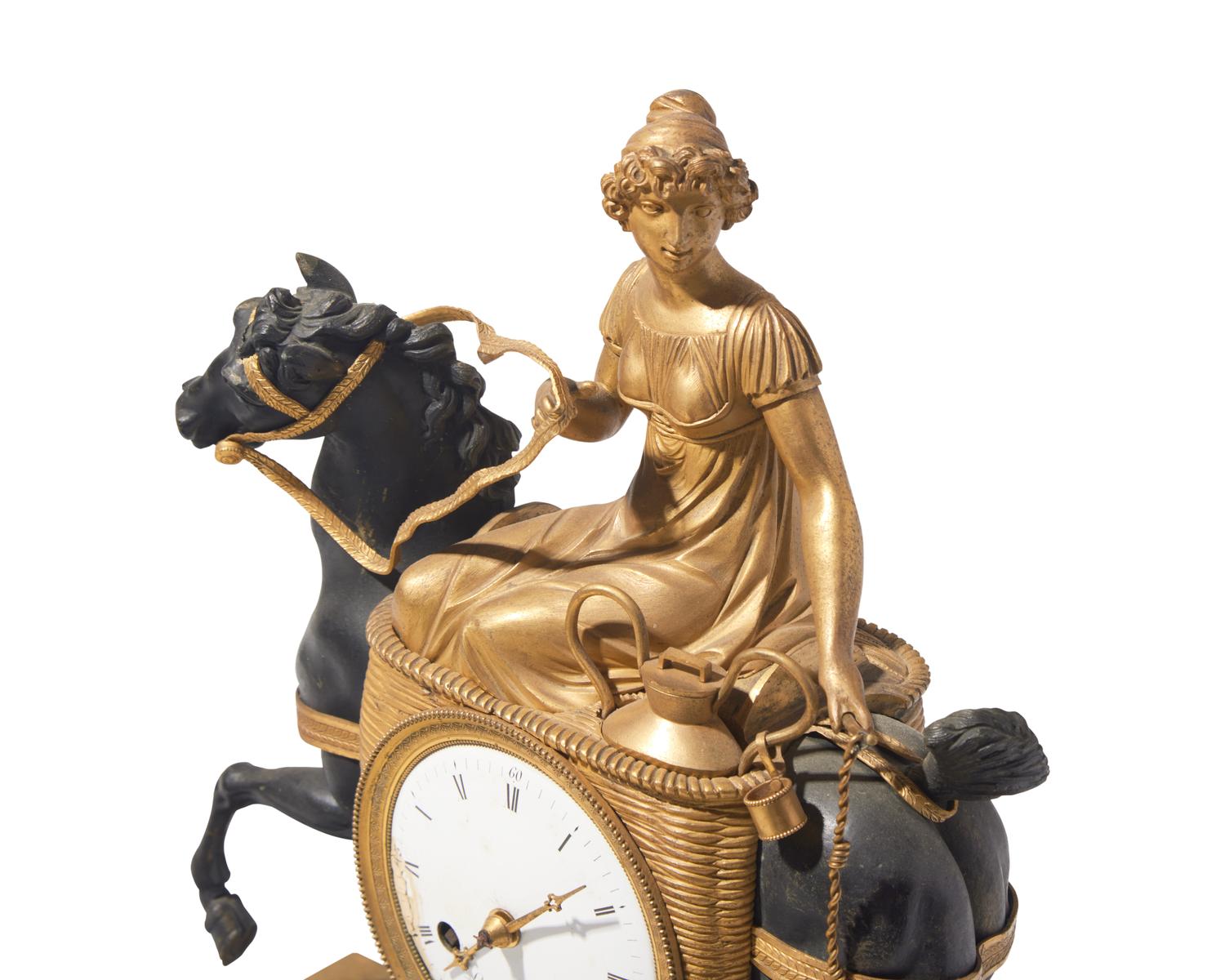 A French Empire gilt and patinated bronze mantel clock depicting a dairy maid on horseback, L. Grognot, Paris, France, early 19th century