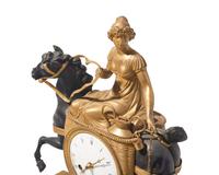 A French Empire gilt and patinated bronze mantel clock depicting a dairy maid on horseback, L. Grognot, Paris, France, early 19th century