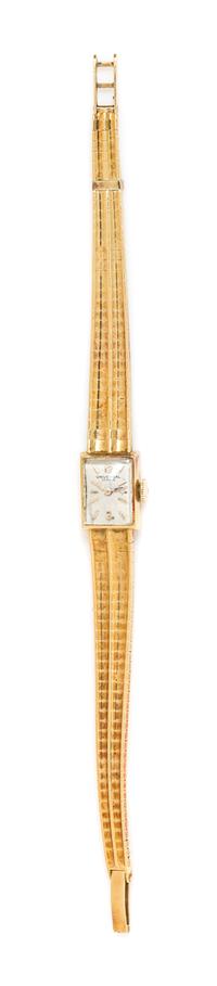 An 18 Karat Yellow Gold Wristwatch, Universal Geneve, 16.90 dwts.