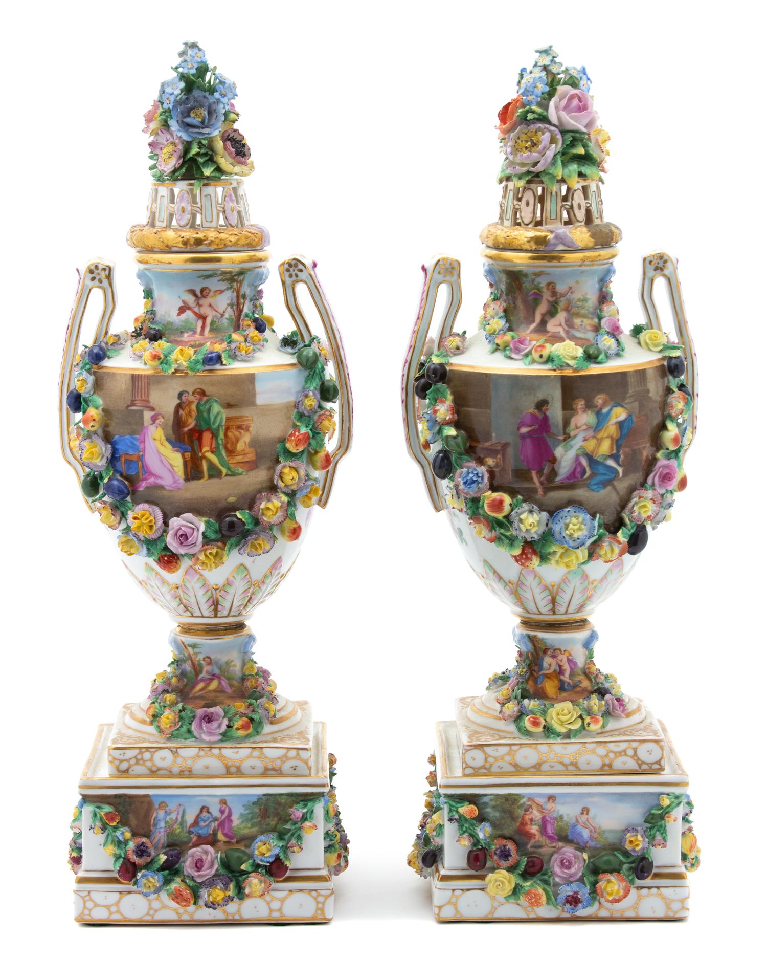 A Pair of Dresden Porcelain Floral Encrusted Covered Urns on Stands Height 17 1/4 inches. — 19TH CENTURY