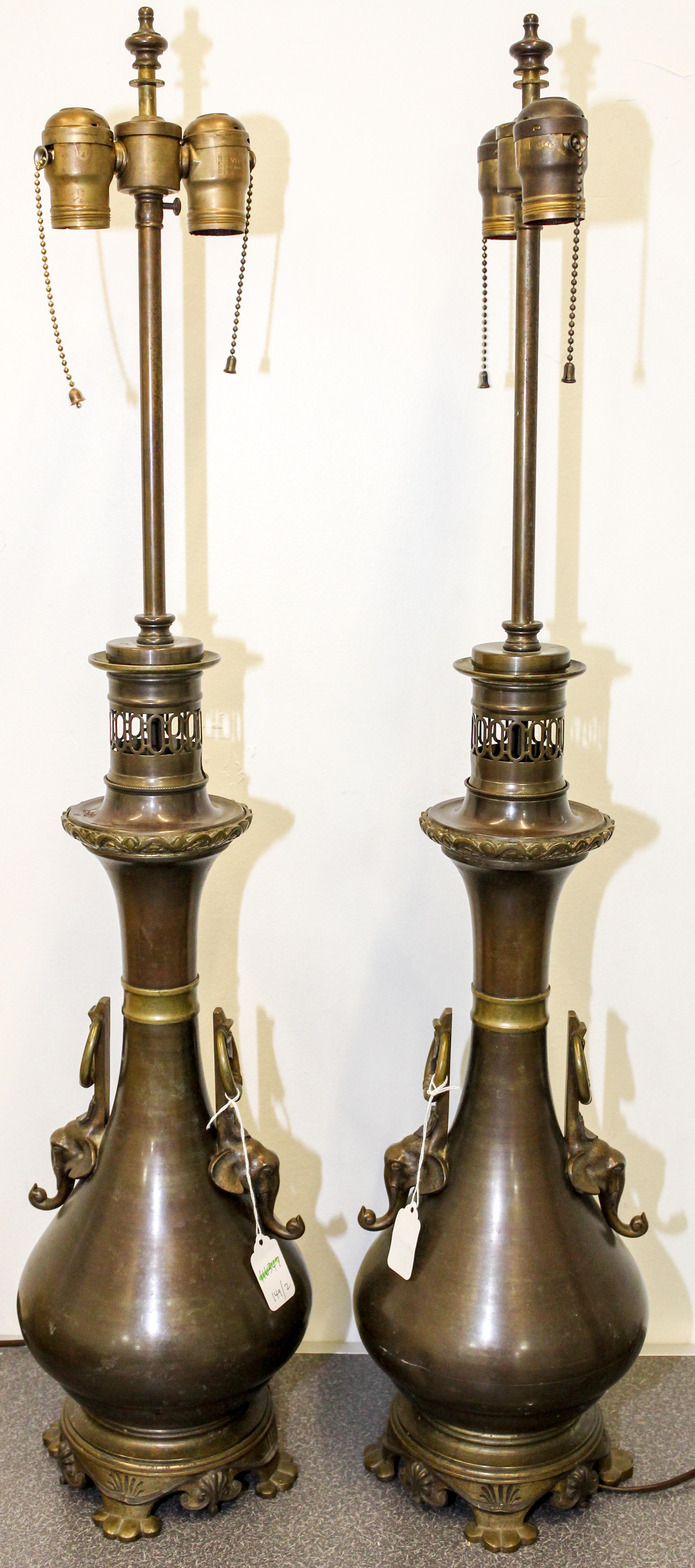 A Pair of Cast Metal Table Lamps Height 34 1/4 inches.
