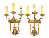 A Pair of French Neoclassical Gilt Bronze Three-Light Sconces, Height 17 1/4 inches.