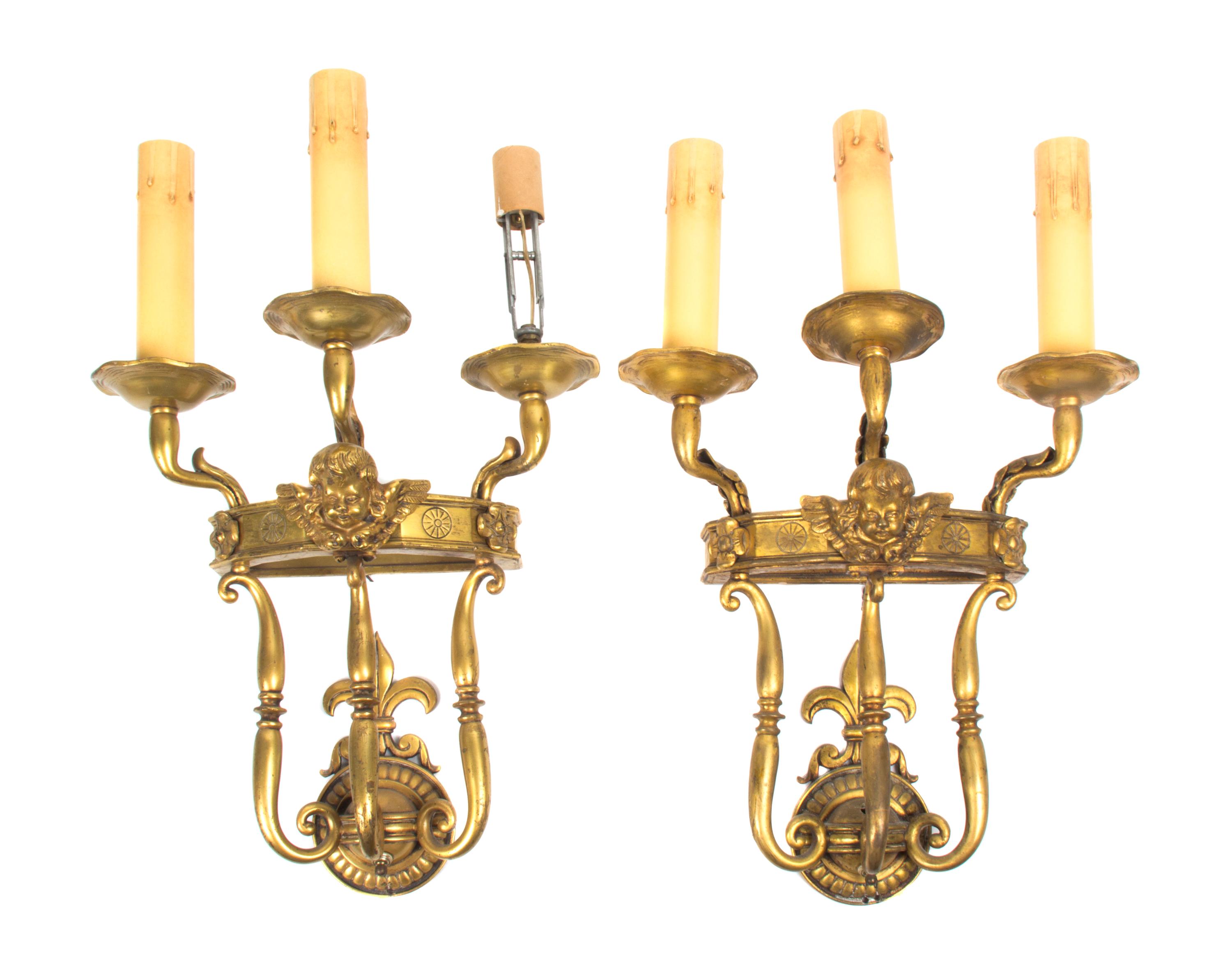 A Pair of French Neoclassical Gilt Bronze Three-Light Sconces, Height 17 1/4 inches.