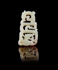 A Chinese Russet and White Jade Reticulated Pendant