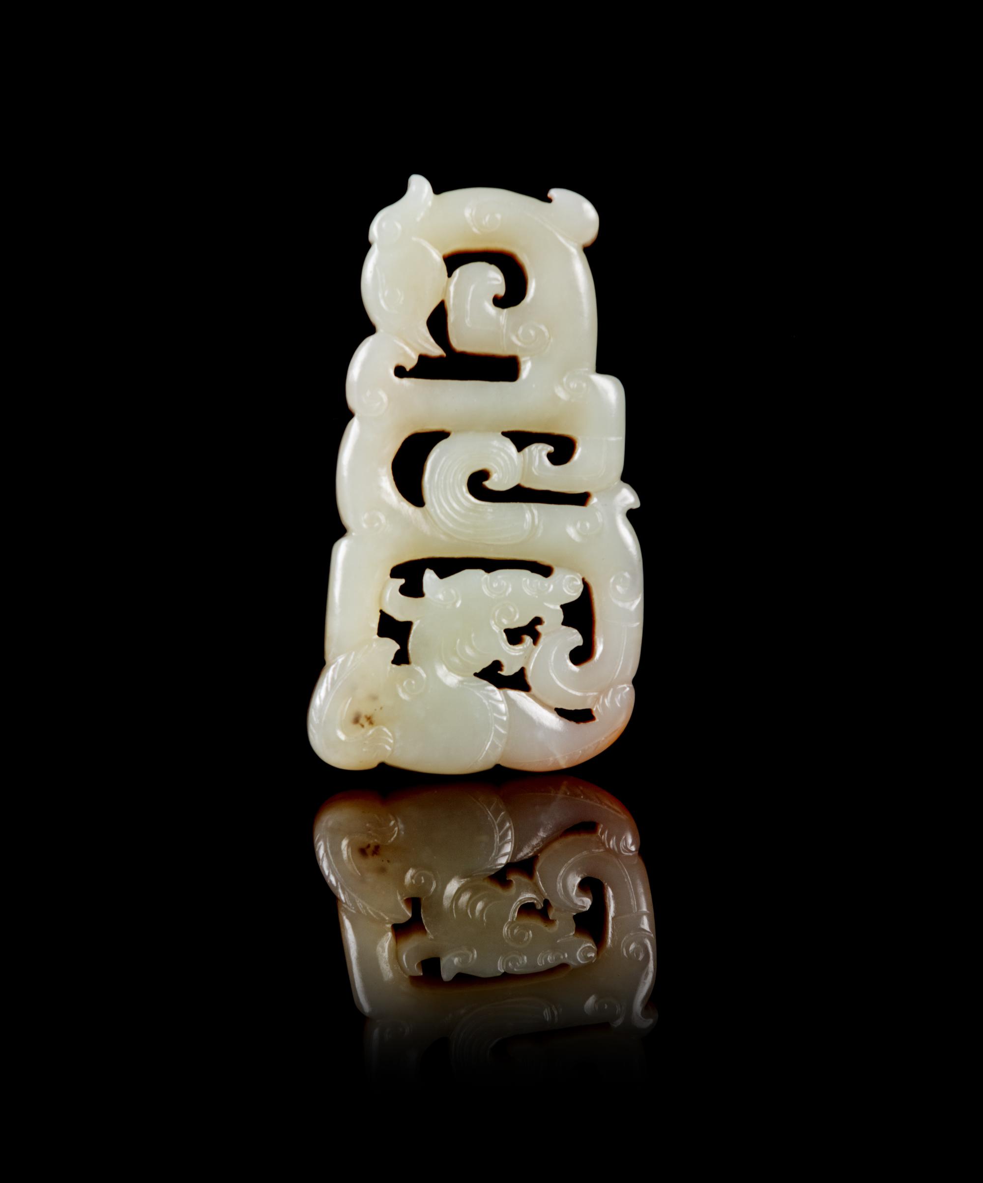A Chinese Russet and White Jade Reticulated Pendant