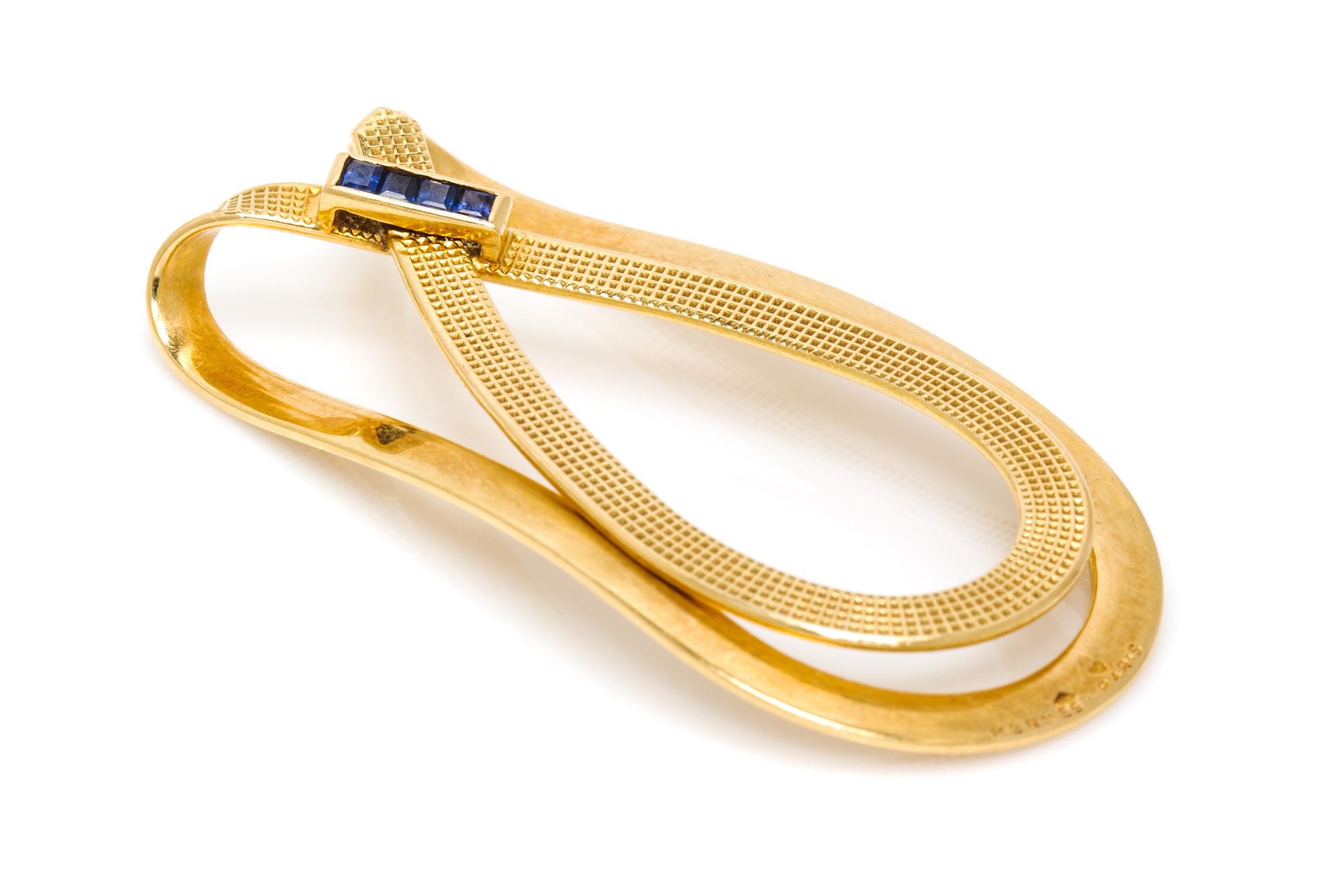 An 18 Karat Yellow Gold and Sapphire Money Clip, Hermes, 9.40 dwts.