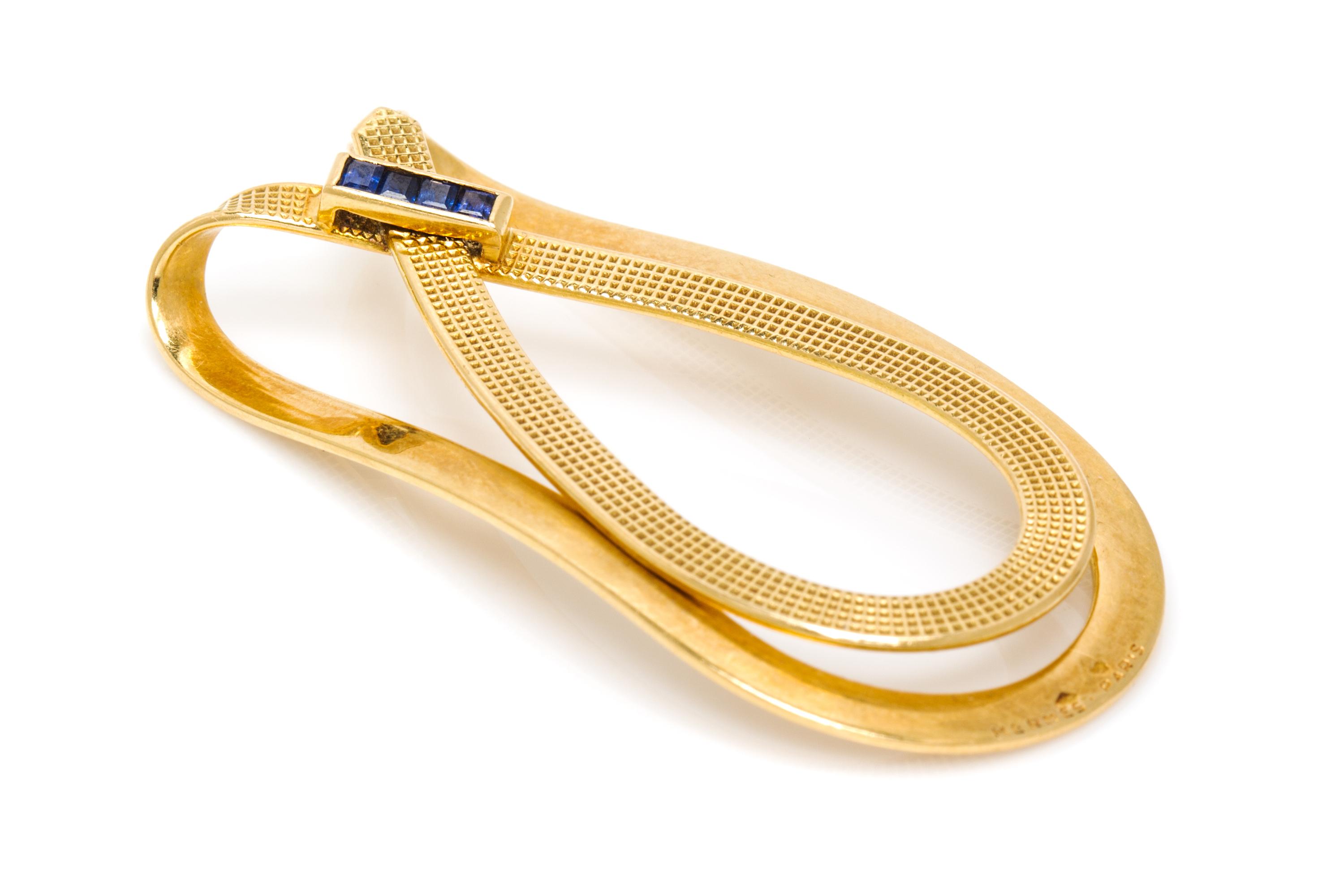 An 18 Karat Yellow Gold and Sapphire Money Clip, Hermes, 9.40 dwts.