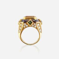 A citrine, diamond, sapphire, peridot, and eighteen karat gold ring