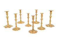 A Group of Eight English Brass Candlesticks