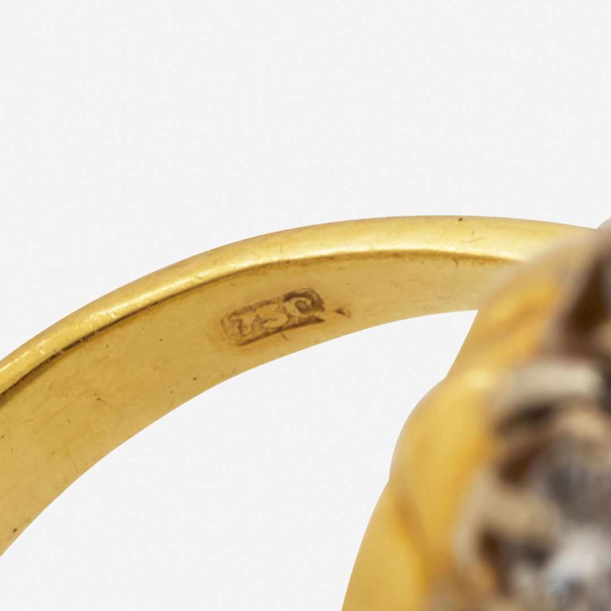 An 18K Yellow Gold, Platinum, Diamond, and Yellow Sapphire Ring