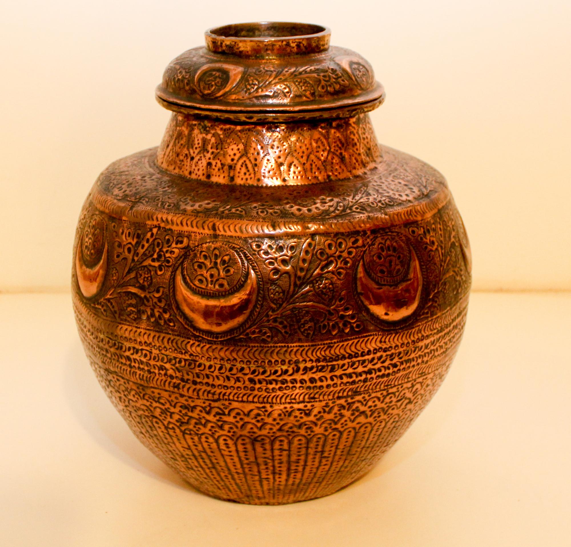 A Hand Hammered Copper Vessel. Height 13 1/2 inches.