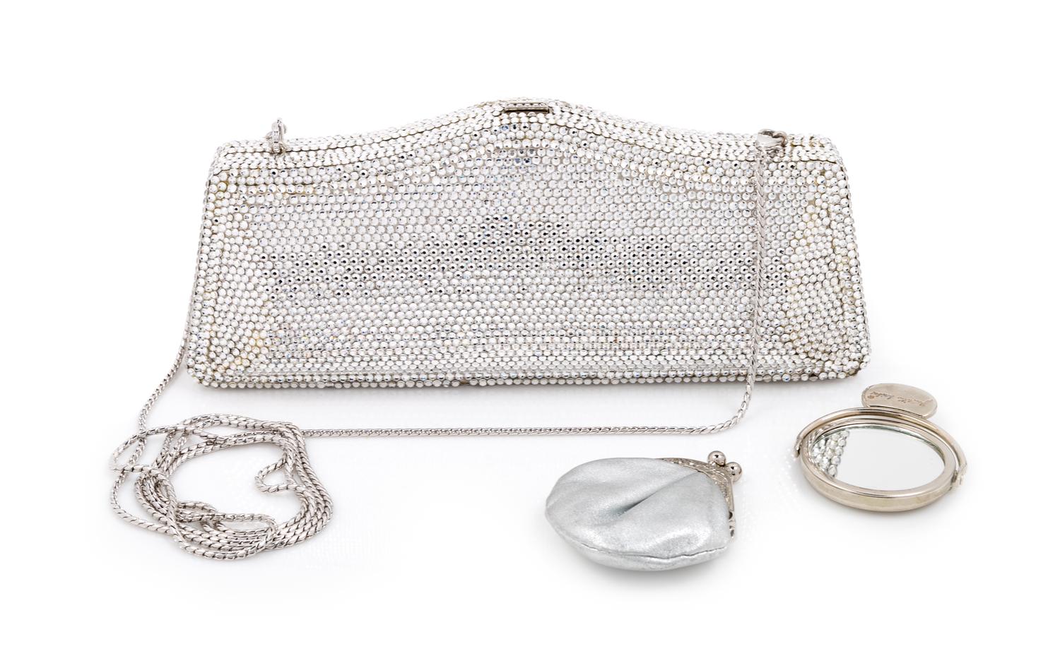 A Judith Leiber Silver Crystal Minaudiere, 3.5" H x 8" W x 1.25" D.