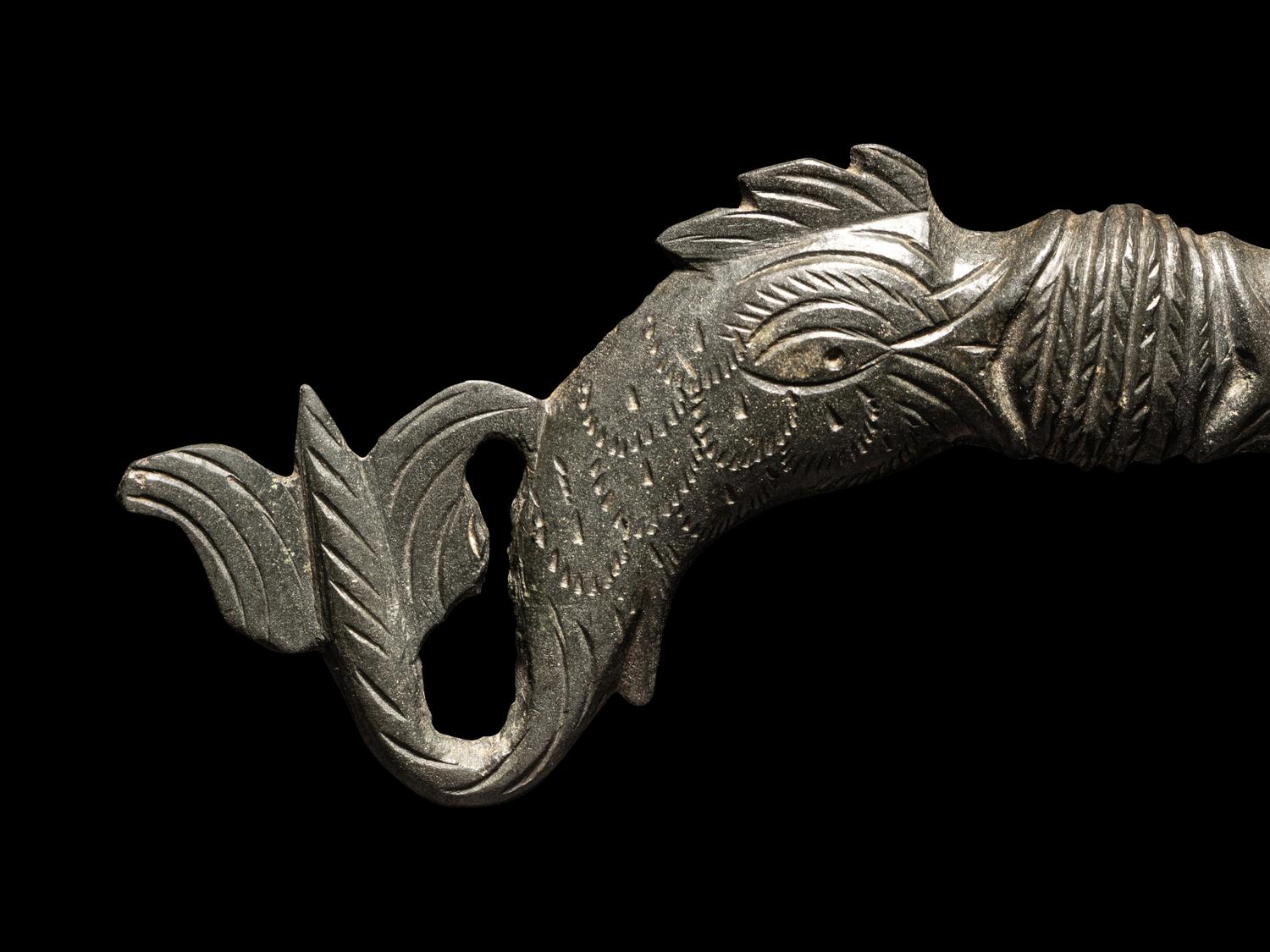 A Roman Bronze Double-Dolphin Handle