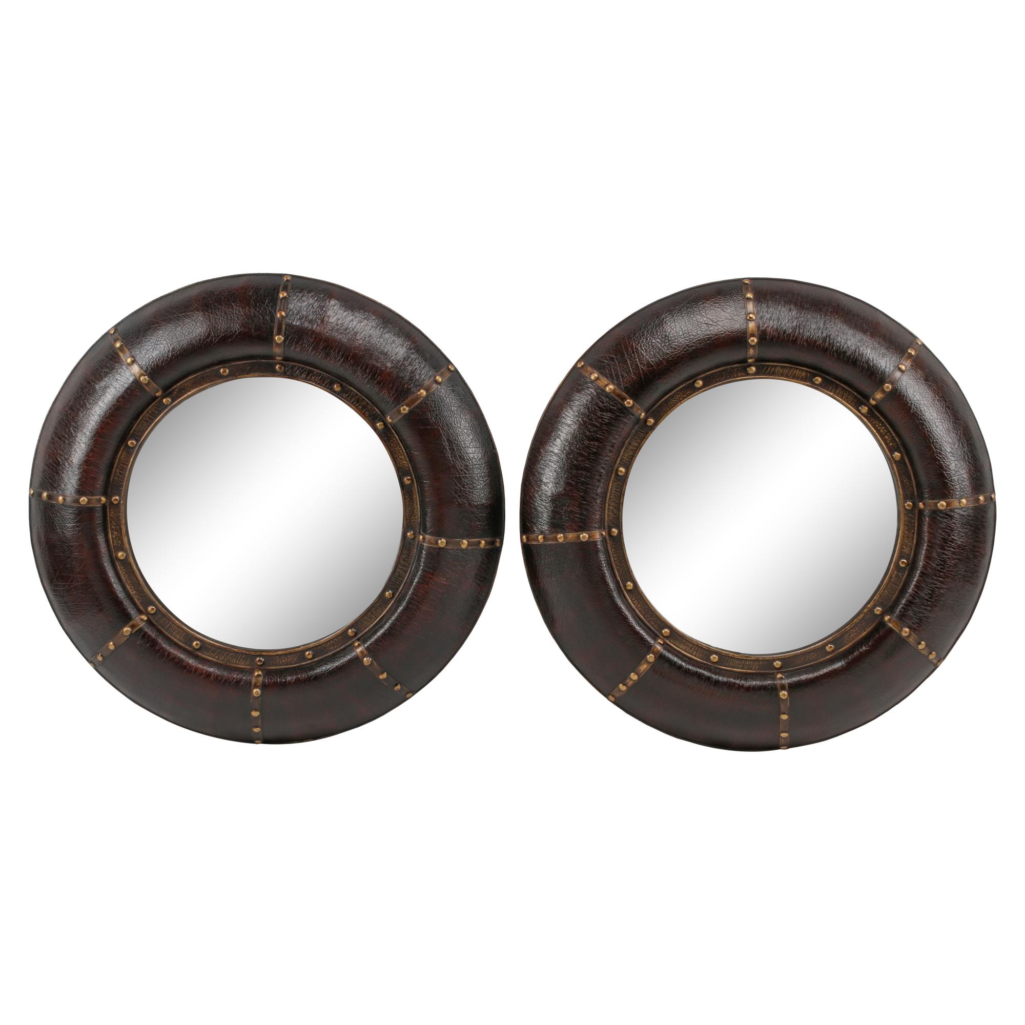 A Pair of Embossed Leather-Framed Mirrors