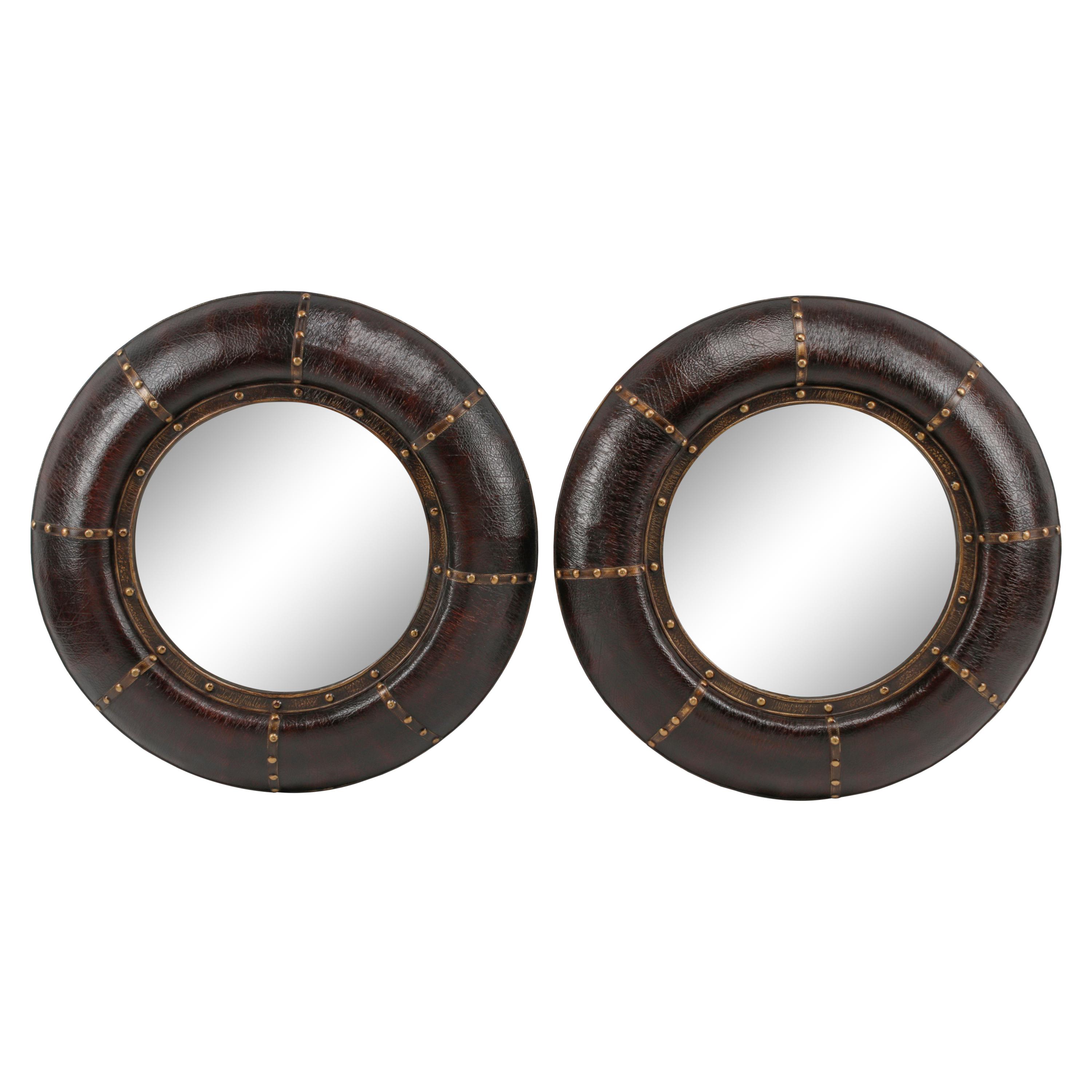 A Pair of Embossed Leather-Framed Mirrors