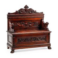 An Italian Renaissance Revival Carved Walnut Settle