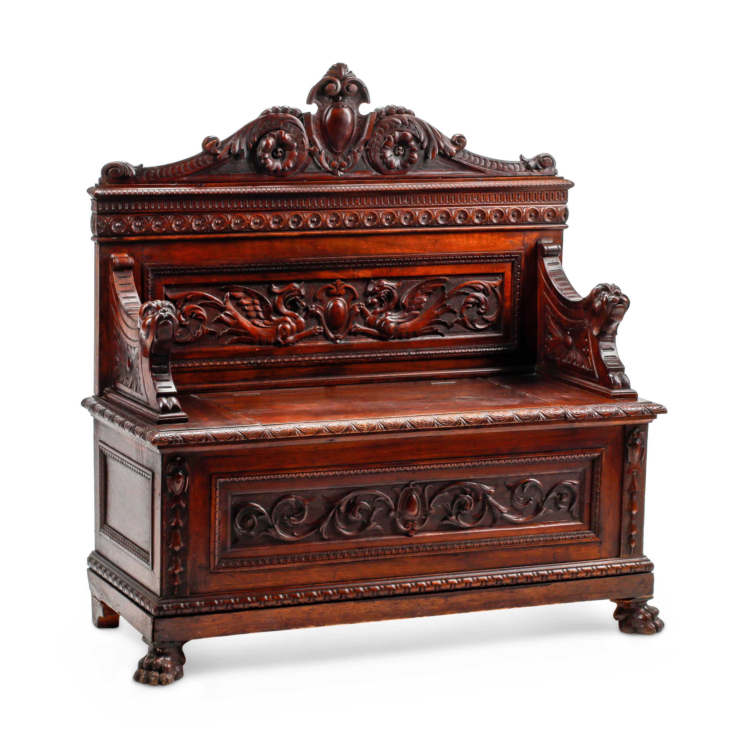An Italian Renaissance Revival Carved Walnut Settle