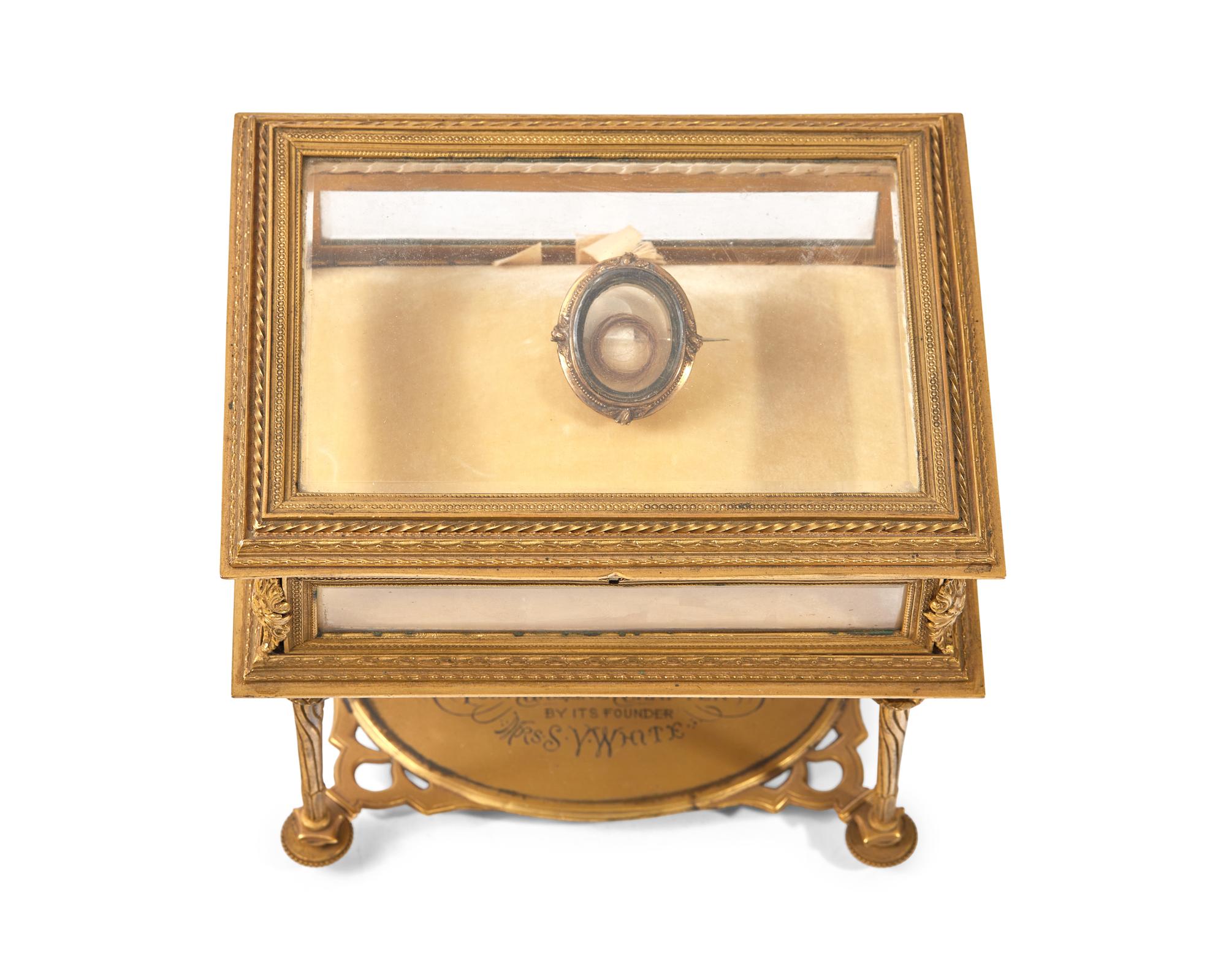 A Mourning Brooch With Hair Of George Washington Mounted In A Gilt Bronze And Glass Vitrine