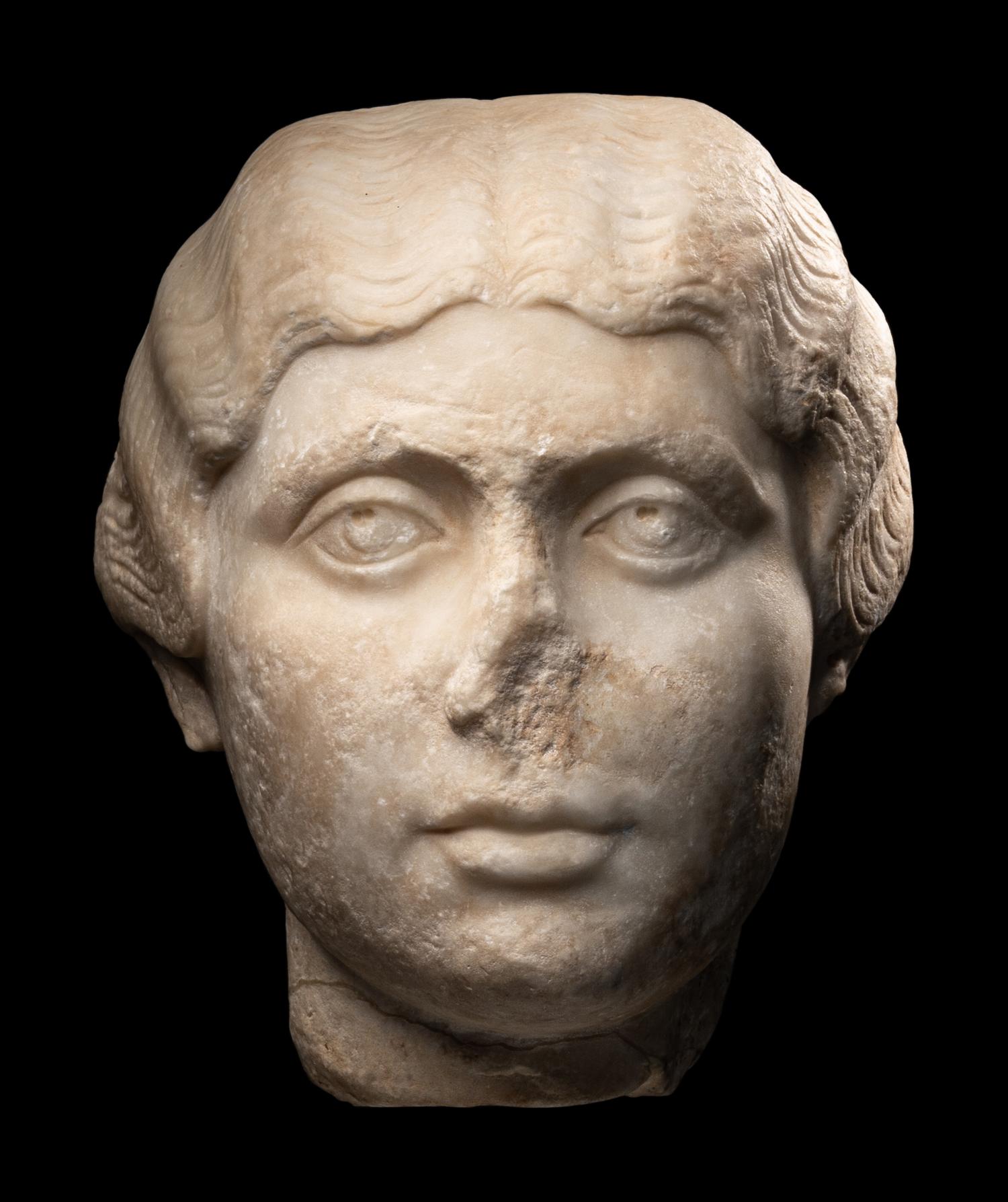 A Roman Marble Portrait Head of a Young Lady