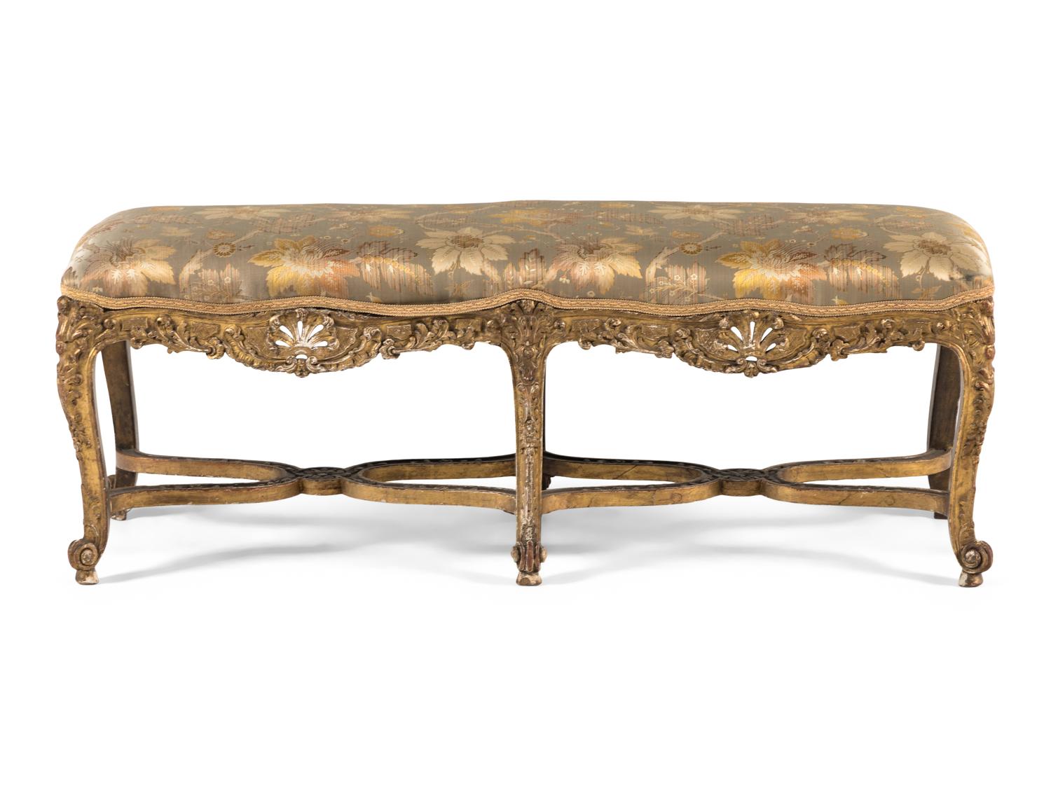 A Louis XV Carved Giltwood Window Bench