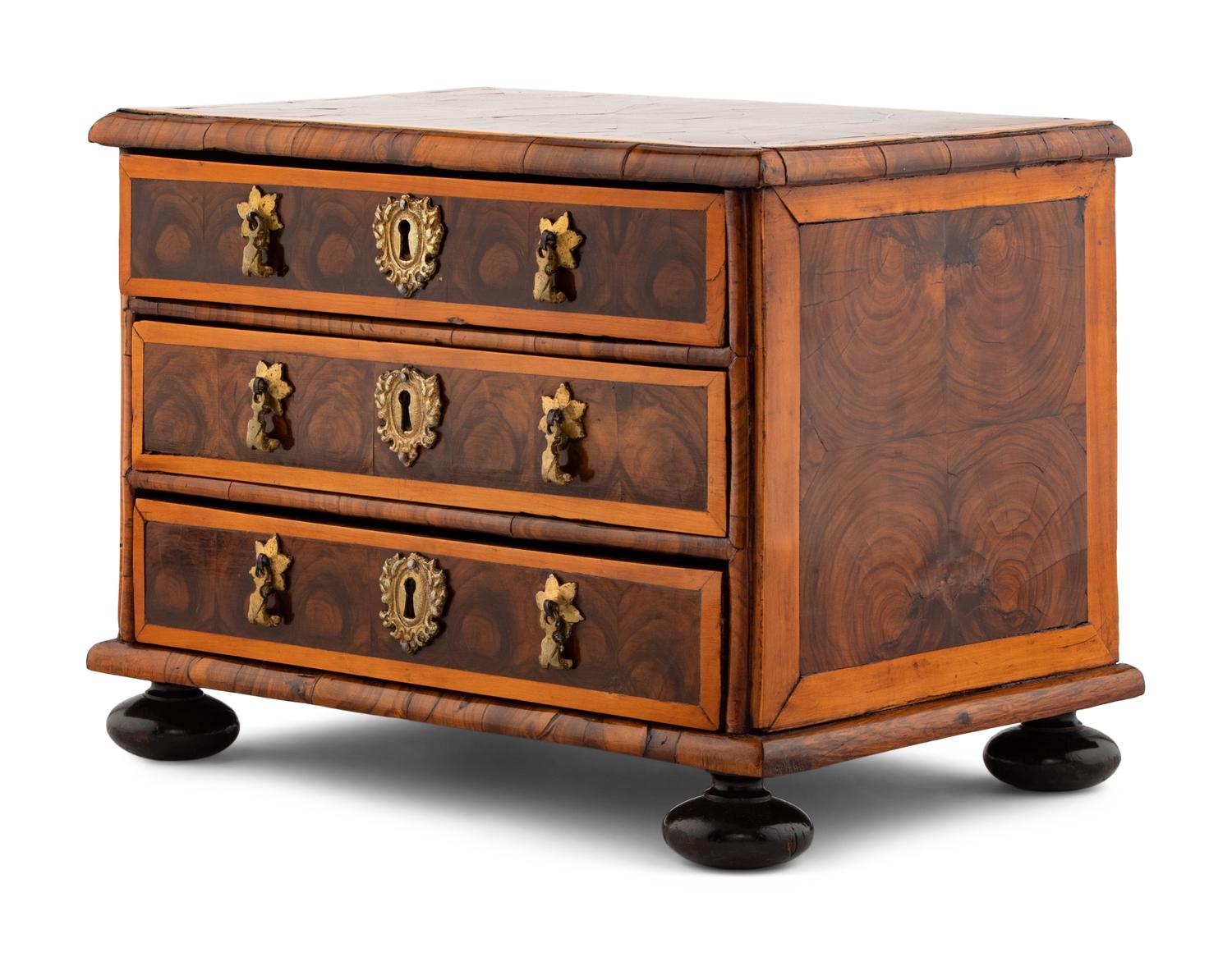 A George I Oysterwood Diminutive Chest of Drawers