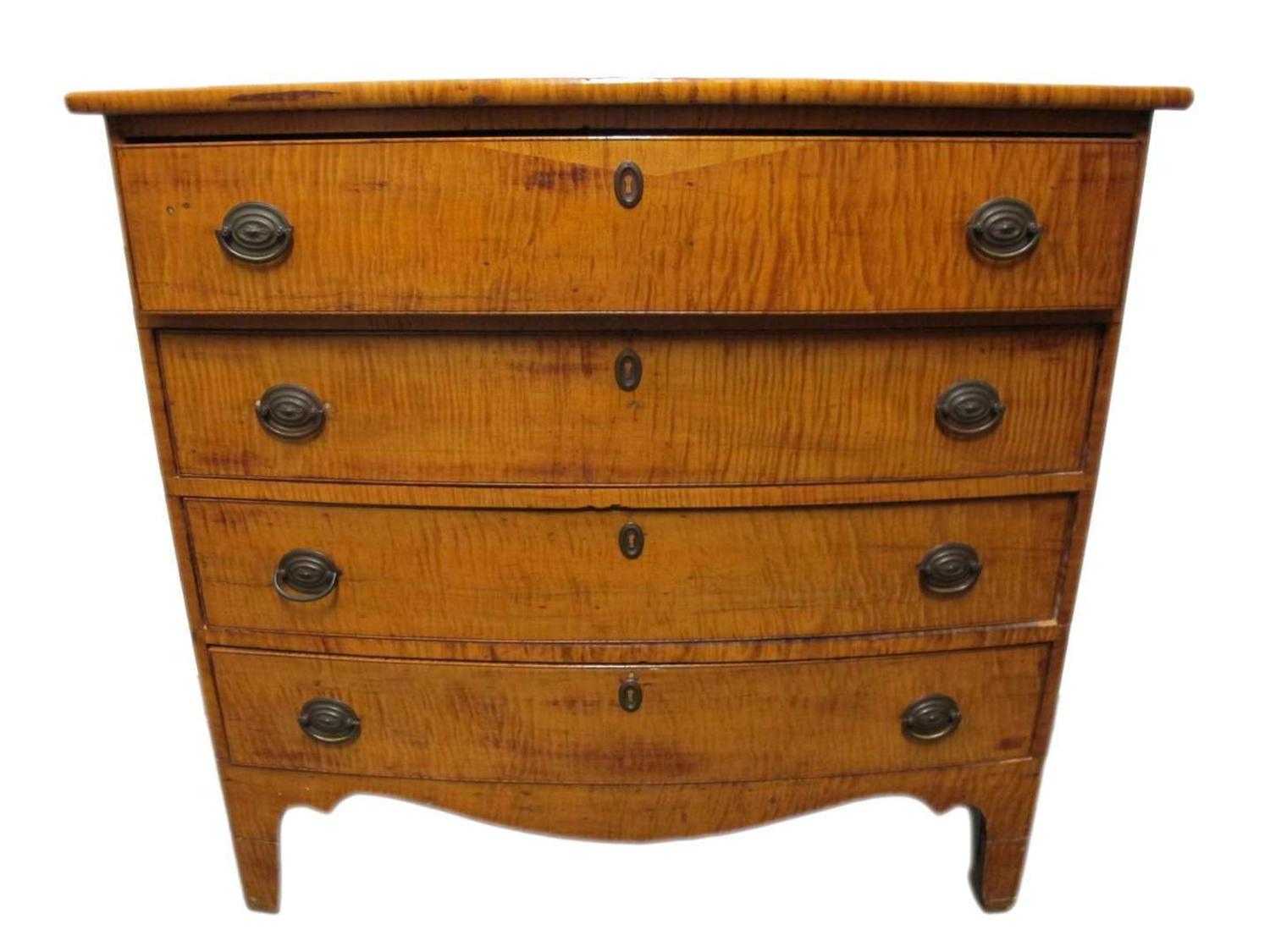 Federal bow front tiger maple chest circa 1800