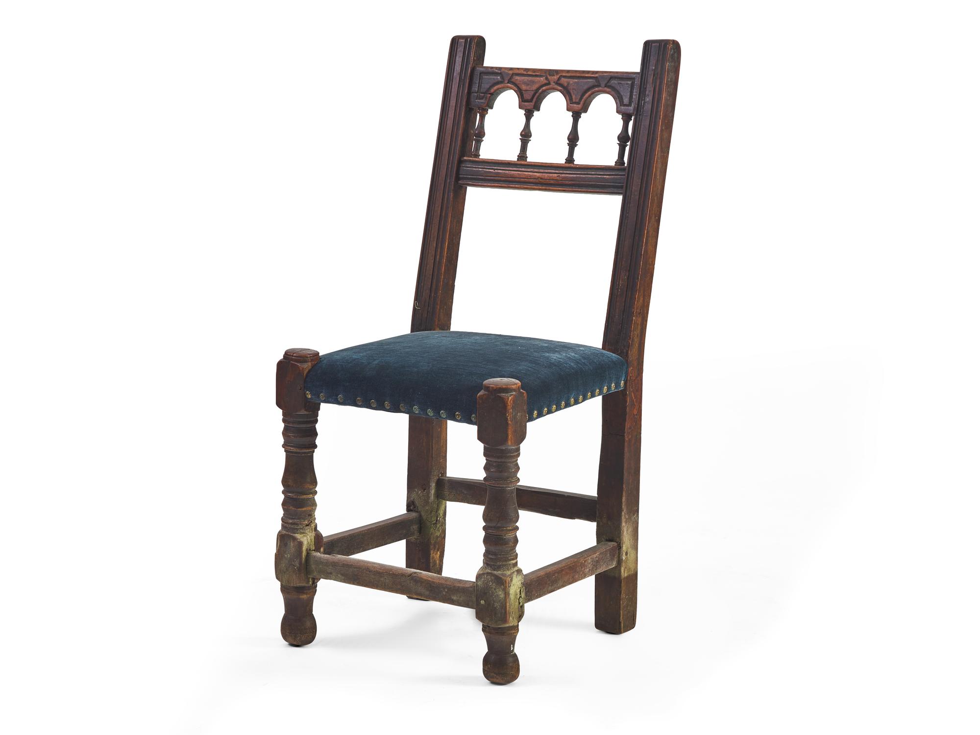 A set of Six Spanish Baroque Carved Walnut and Upholstered Side Chairs