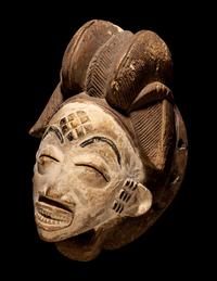 Four Punu Wood Masks