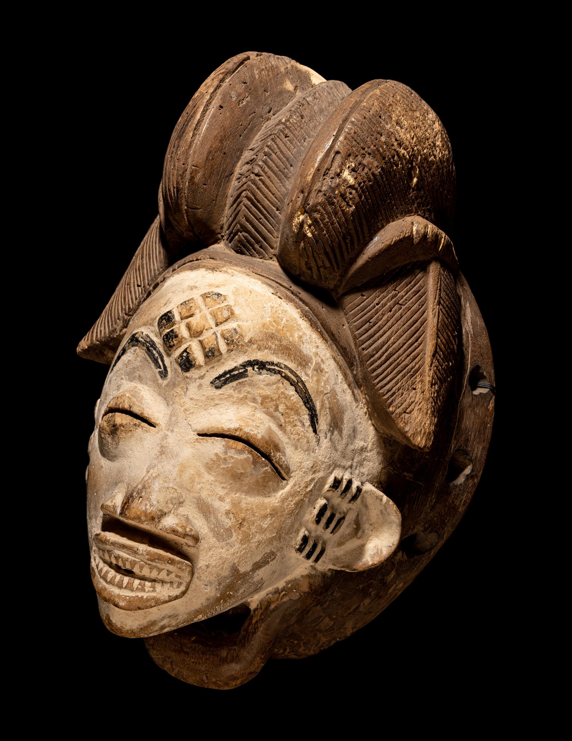 Four Punu Wood Masks