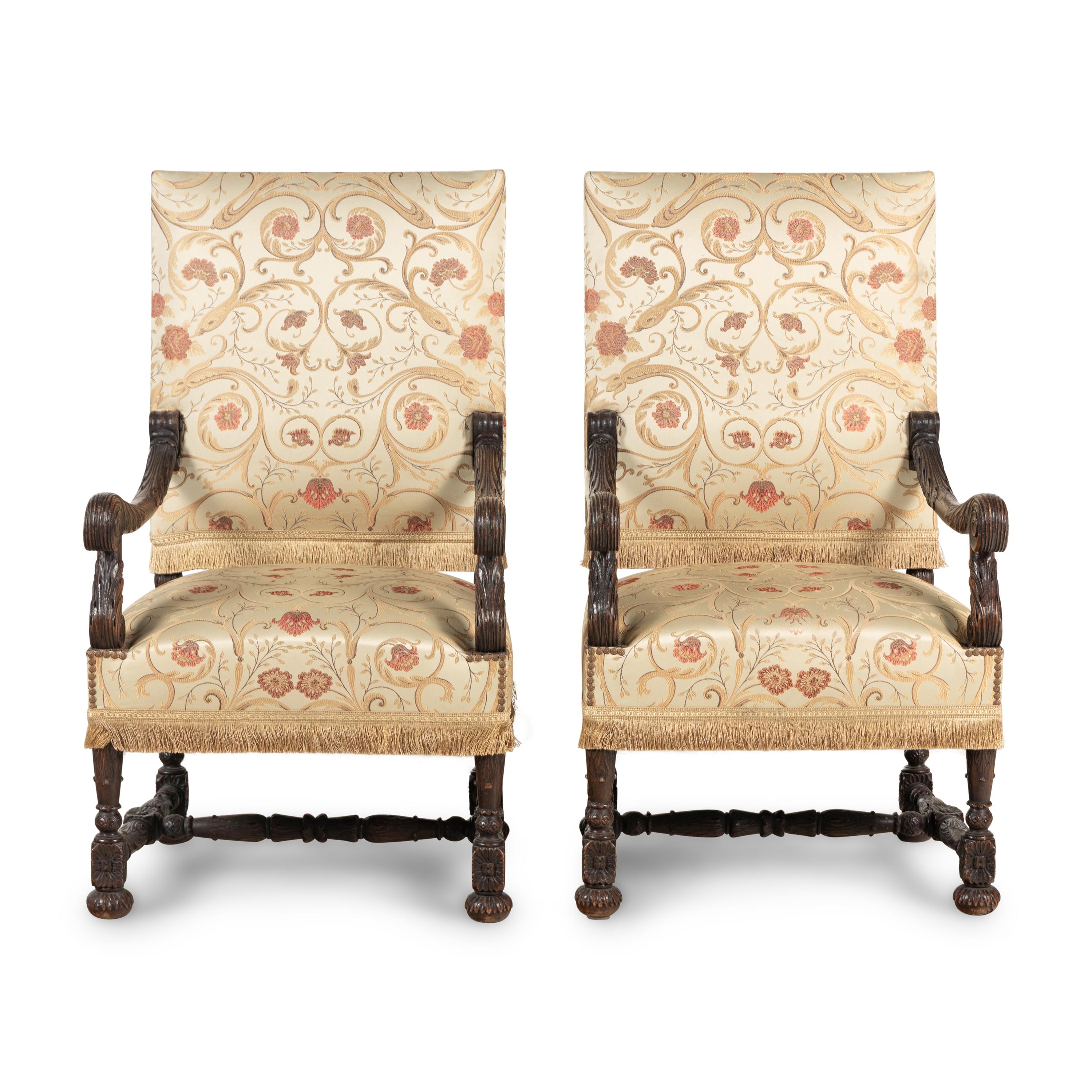 A Pair of Louis XIII Style Carved Oak Fauteuils
