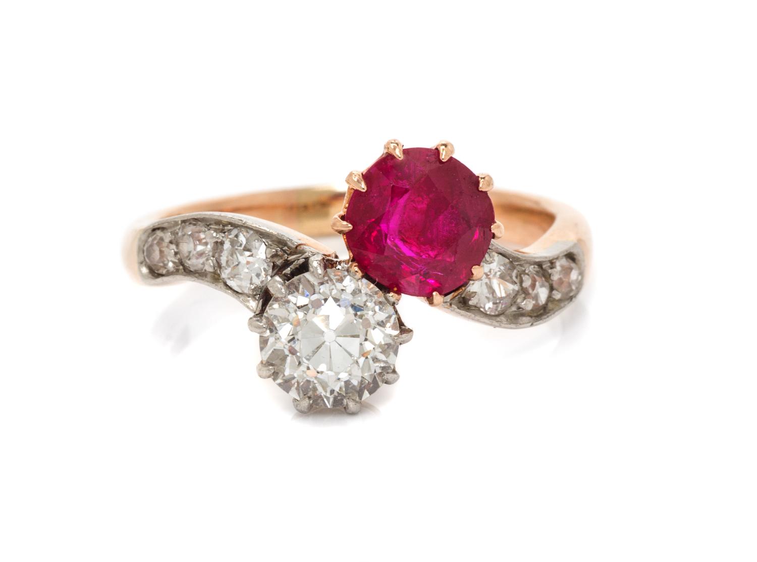 An Edwardian Platinum Topped Gold, Ruby and Diamond Toi et Moi Ring, 4.40 dwts.