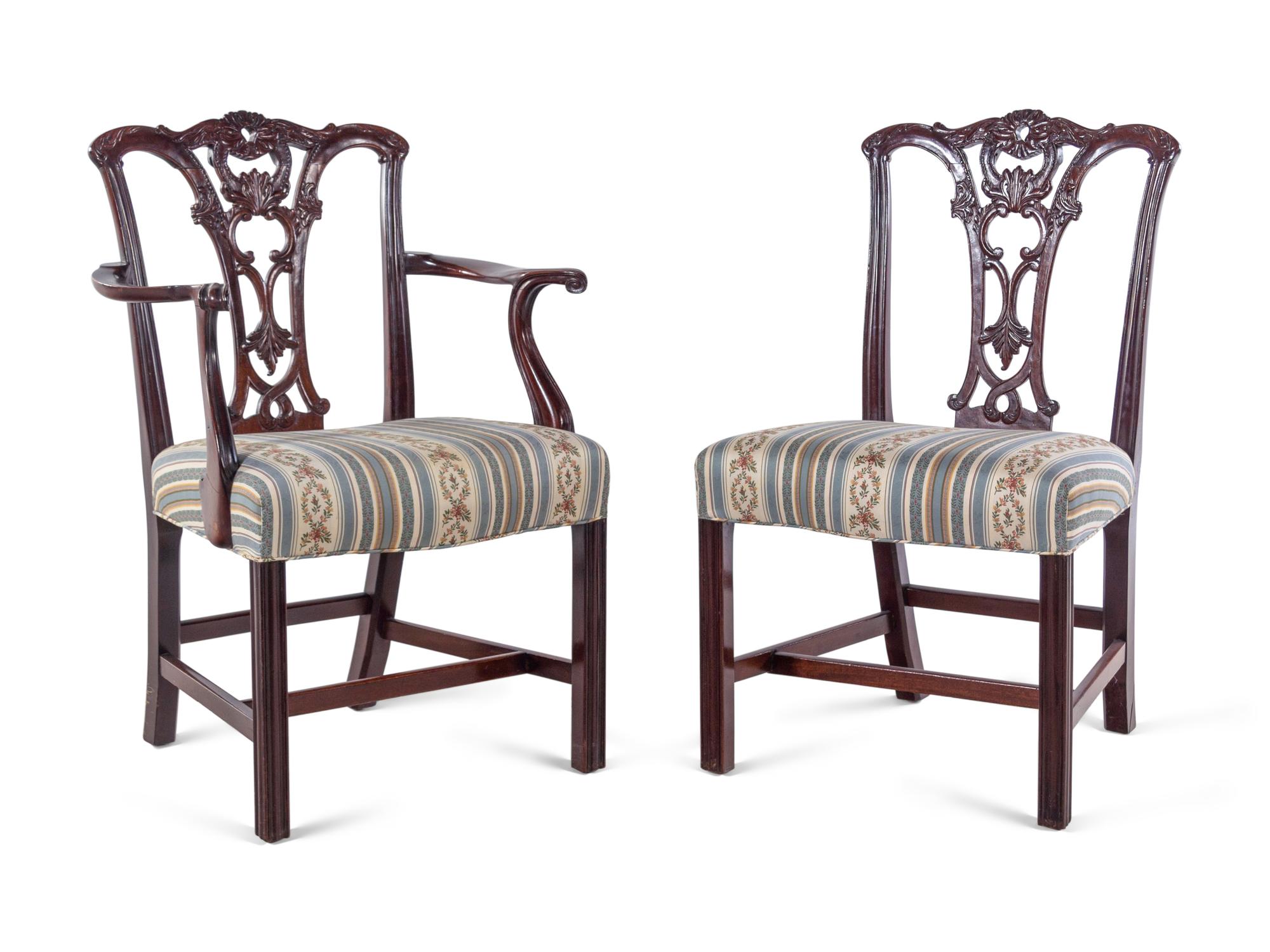 A Set of Fourteen George III Style Carved Mahogany Dining Chairs