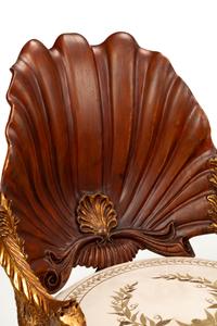 A Pair of Grotto Style Parcel Gilt Carved Walnut Armchairs