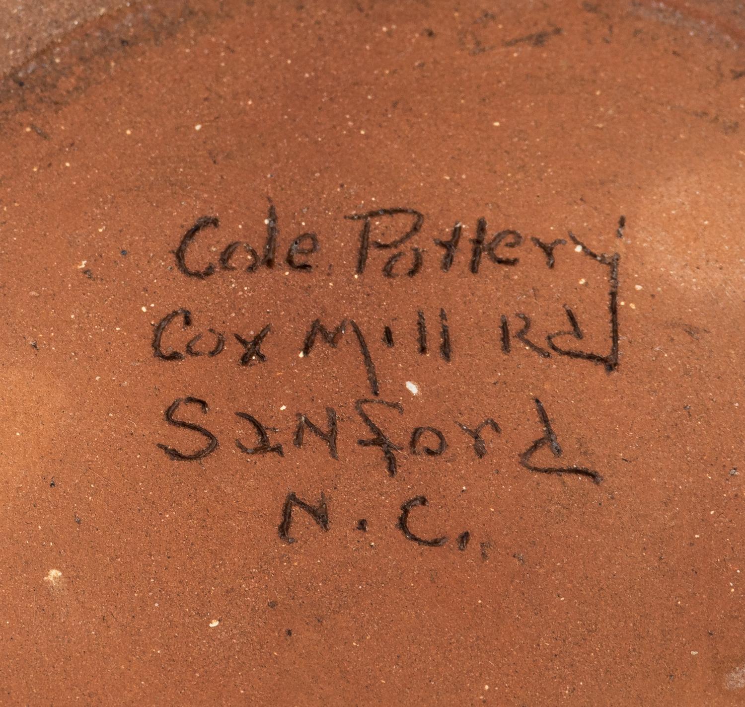 A Cole Pottery Glazed Stoneware Face Jug