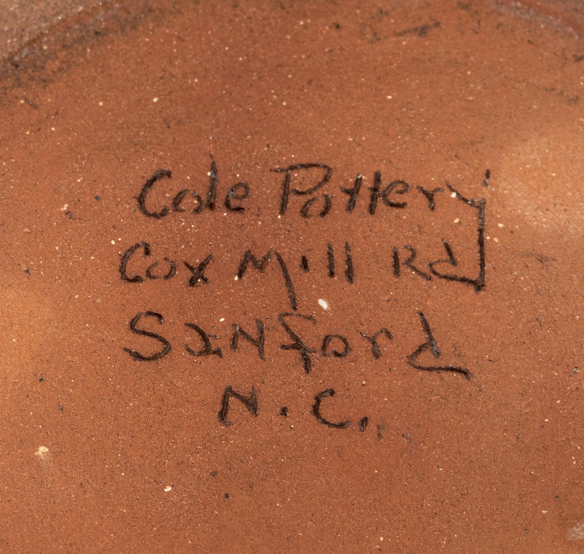 A Cole Pottery Glazed Stoneware Face Jug