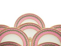 A Set of Thirteen Pink and Green Painted Porcelain Luncheon Plates