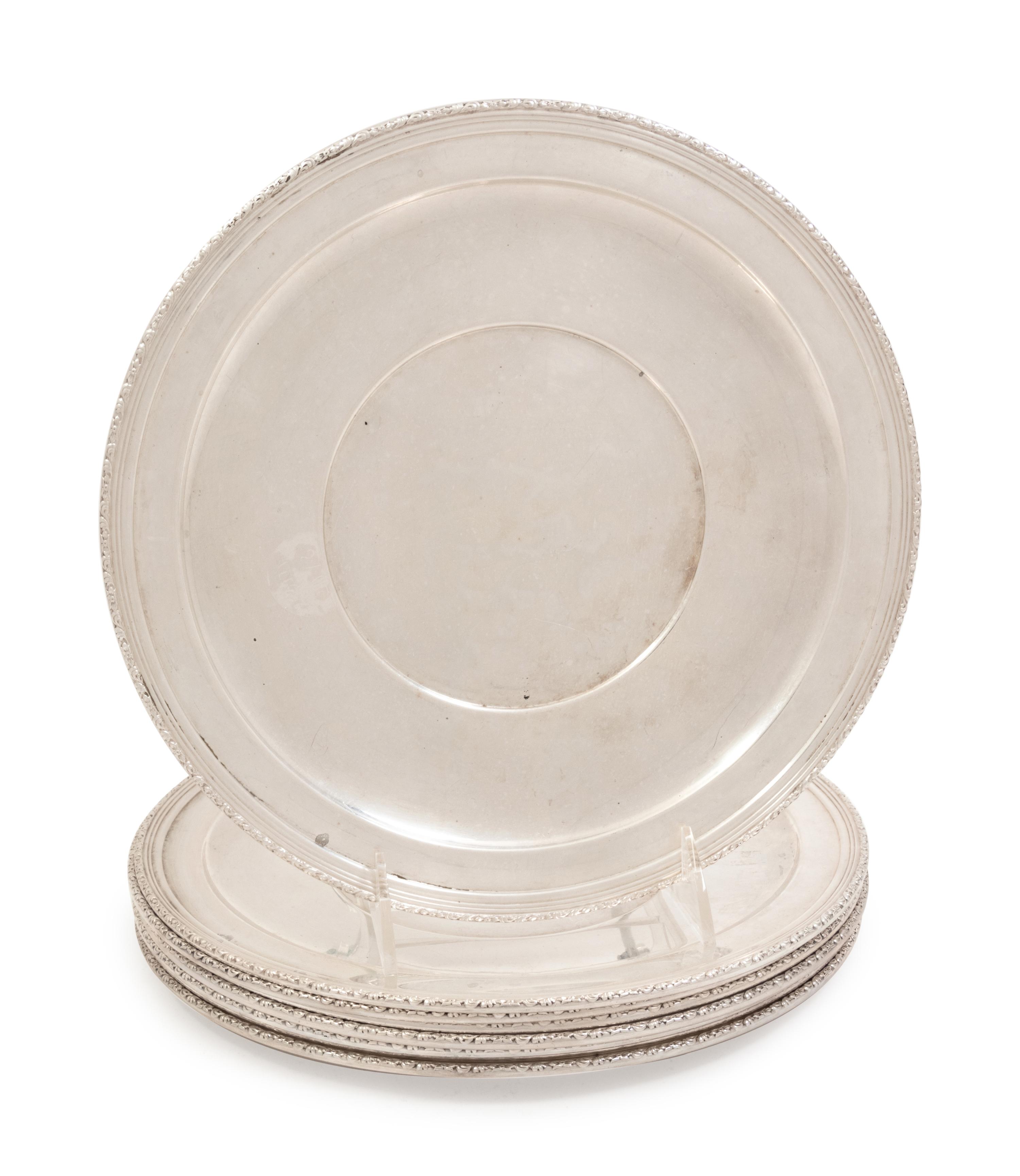 A Set of Eight American Silver Dinner Plates