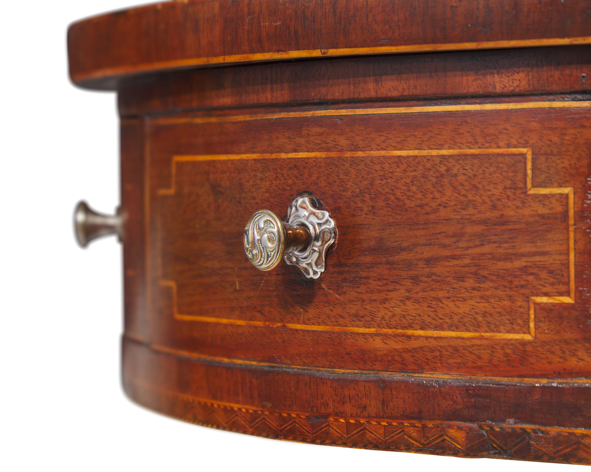 A small Regency inlaid mahogany drum table, circa 1820