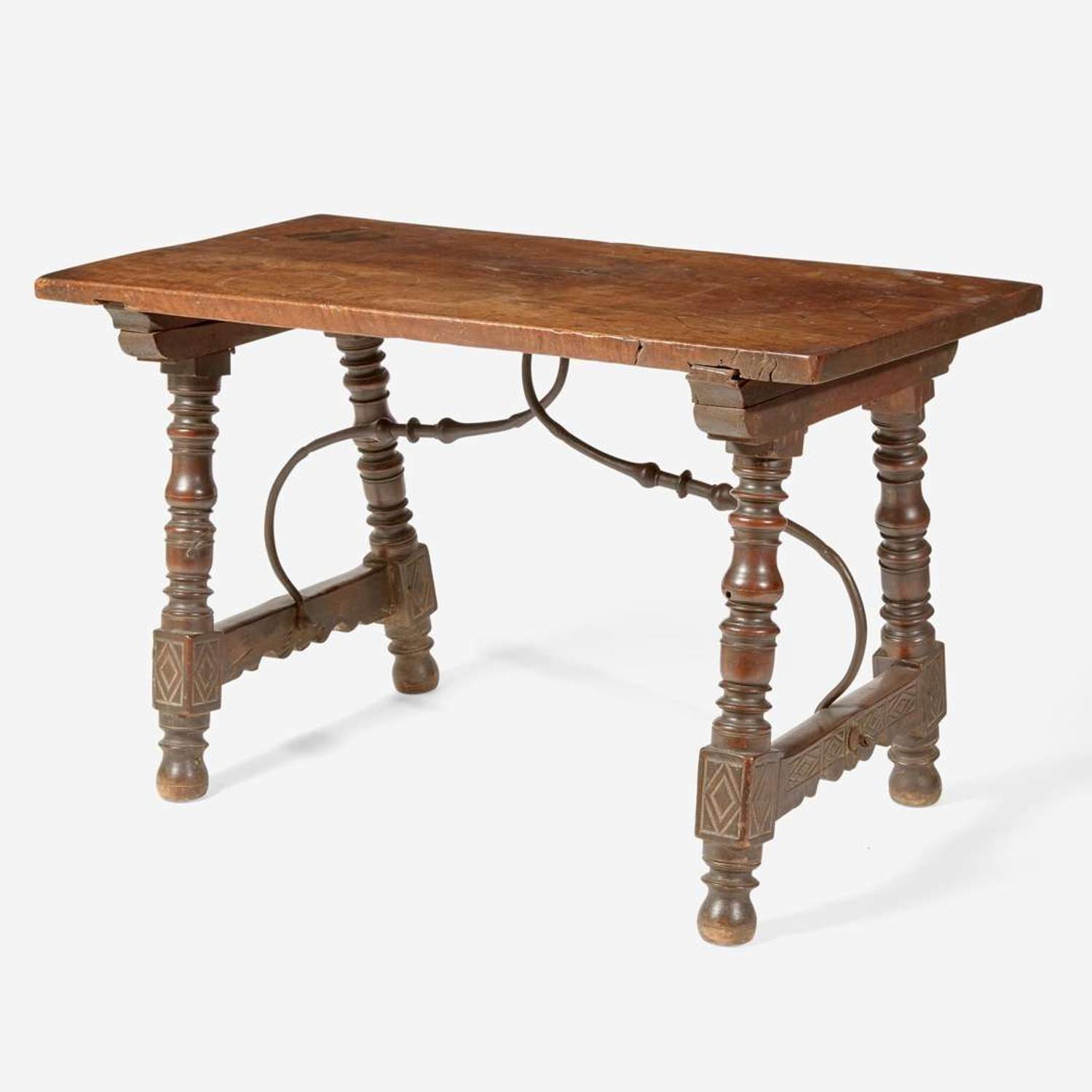 A Spanish Baroque carved walnut and iron stretcher table Probably 17th century