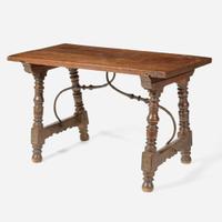 A Spanish Baroque carved walnut and iron stretcher table Probably 17th century