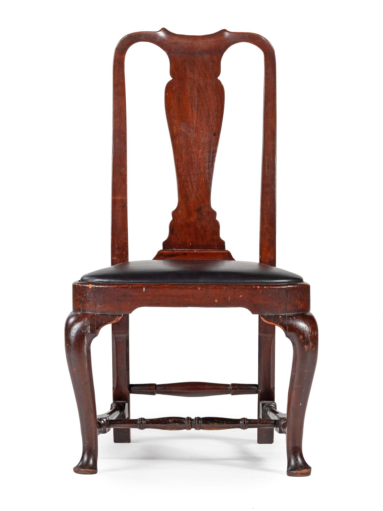 A Queen Anne Carved Walnut Compass-Seat Stretcher-Base Side Chair