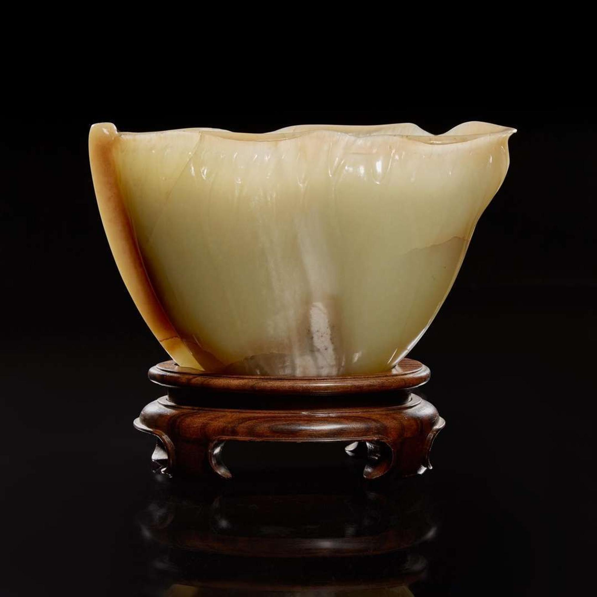 A Chinese carved celadon jade "Lotus" coupe 蓮葉玉杯