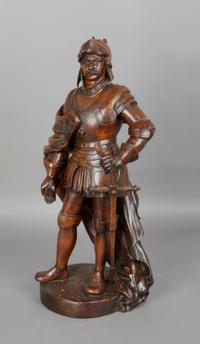 A Continental Carved Wood Figure, Height 19 inches.